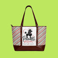 A tote bag with dark brown faux-leather trim and handles, featuring a white front panel with a black poodle graphic, pink heart outline, and the words 'Poodle Mom' and 'Curls. Love.